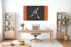 Caleb Williams navy and orange silhouette canvas above a desk in a home office