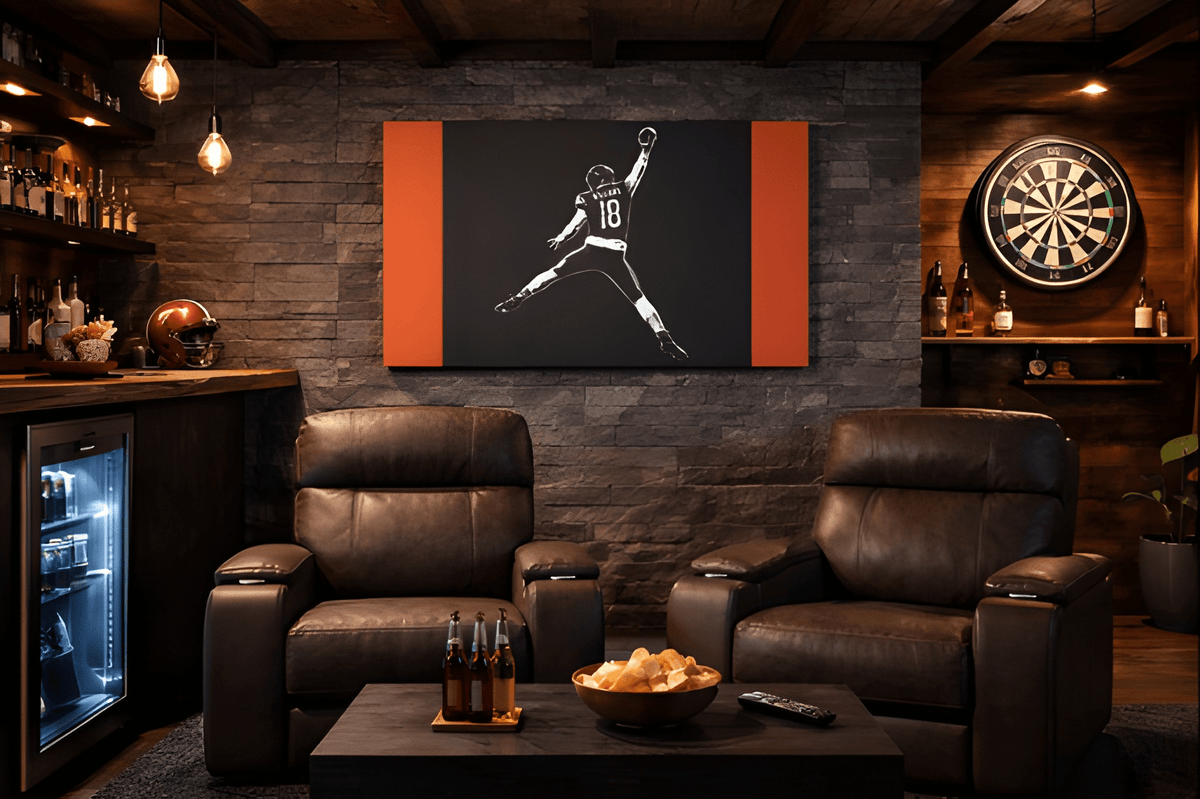Caleb Williams navy and orange silhouette canvas in a man cave with leather recliners