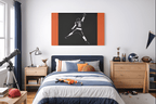 Caleb Williams navy and orange silhouette canvas above a bed in a bedroom