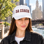 Woman wearing the Da Coach embroidered foam trucker hat in white on the Chicago Riverwalk