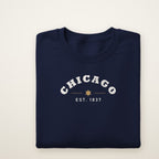 Chicago Est. 1837 youth crewneck in Navy, flat lay showing the arched CHICAGO and city star print
