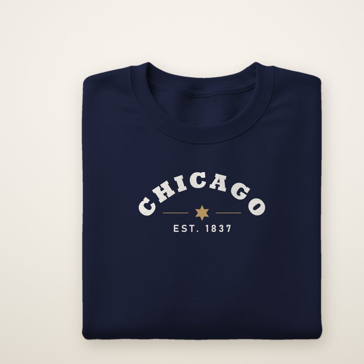 Chicago Est. 1837 youth crewneck in Navy, flat lay showing the arched CHICAGO and city star print