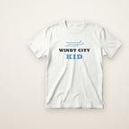 Windy City Kid toddler tee in White, flat lay with blue wind lines over WINDY CITY KID