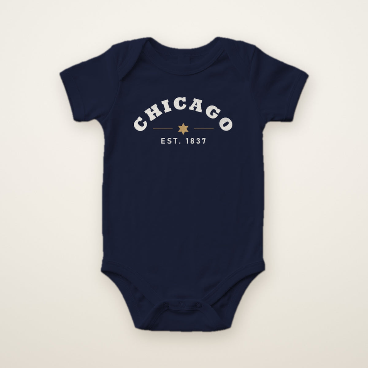 Chicago Est. 1837 baby bodysuit in Navy, flat lay with white arched CHICAGO print