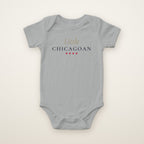 Little Chicagoan baby bodysuit in Heather, flat lay with gold script and four red stars