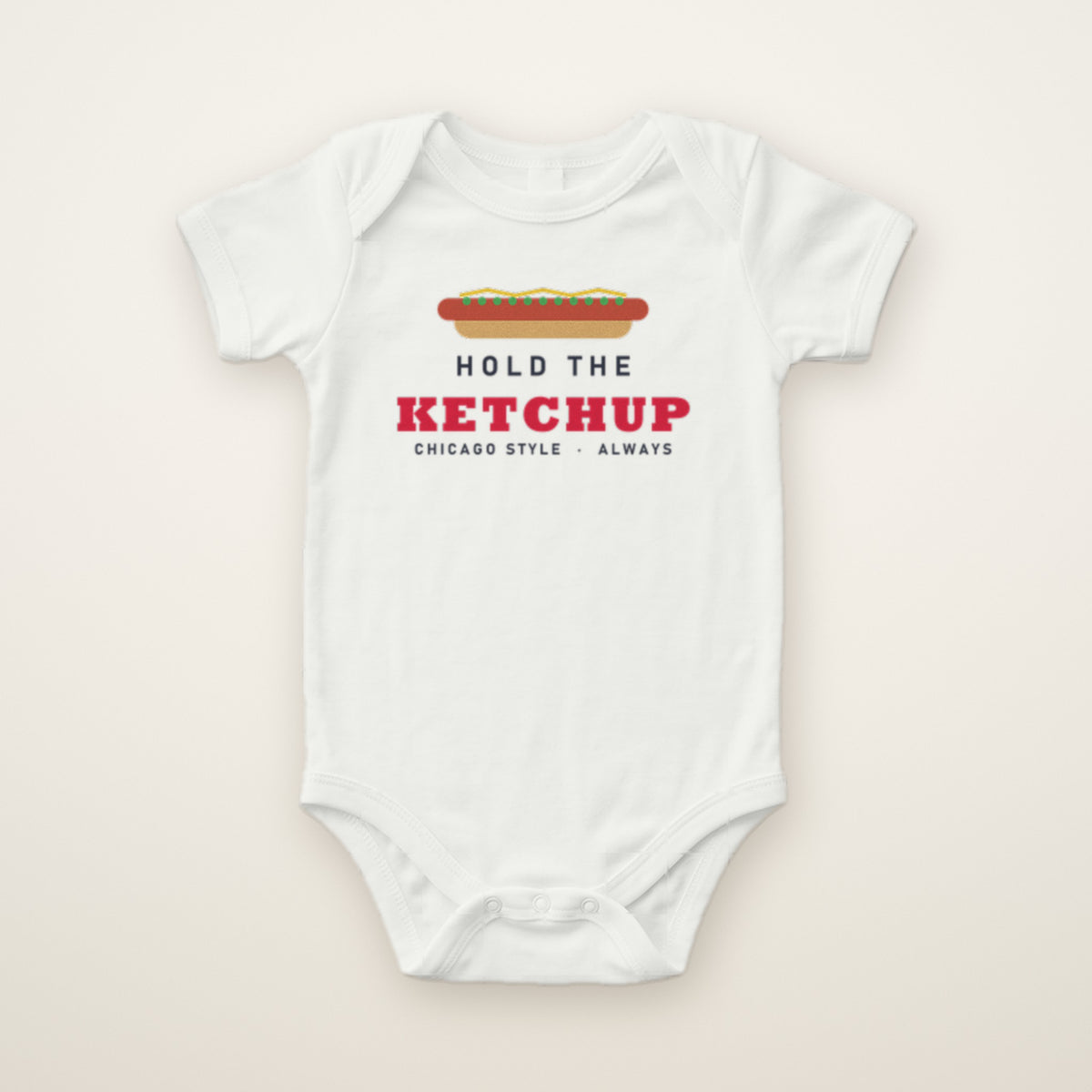 Hold the Ketchup baby bodysuit in White, flat lay with Chicago-style hot dog print