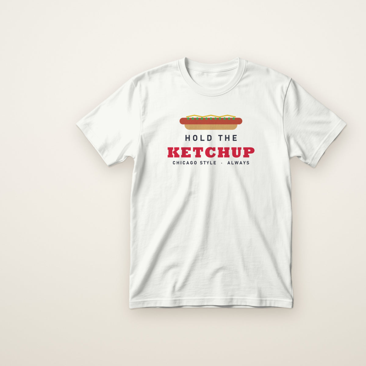 Hold the Ketchup toddler tee in White, flat lay with Chicago-style hot dog and red KETCHUP