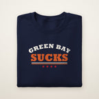 Green Bay Sucks Varsity crewneck in Navy, flat lay with arched GREEN BAY over orange SUCKS