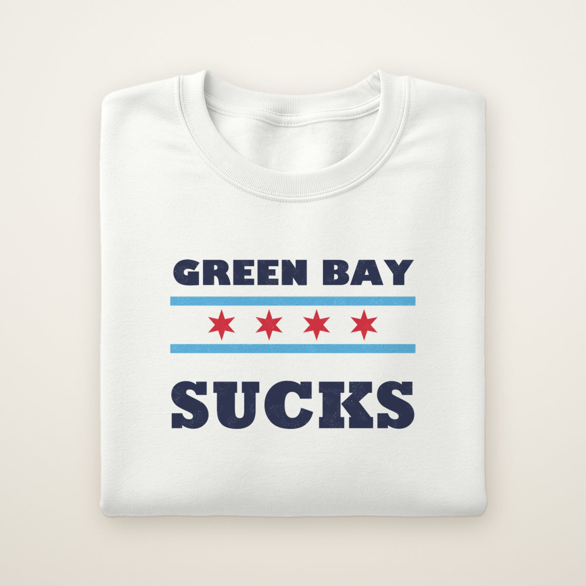 Green Bay Sucks Chicago Flag crewneck in White, flat lay with Chicago flag stars between the words