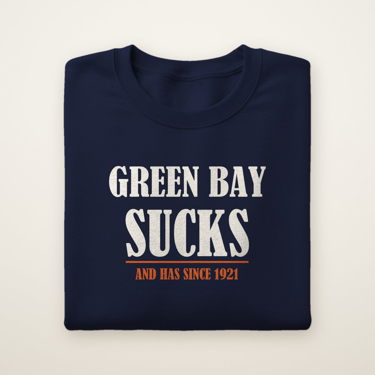 Green Bay Sucks And Has Since 1921 crewneck in Navy, flat lay with tall vintage block type