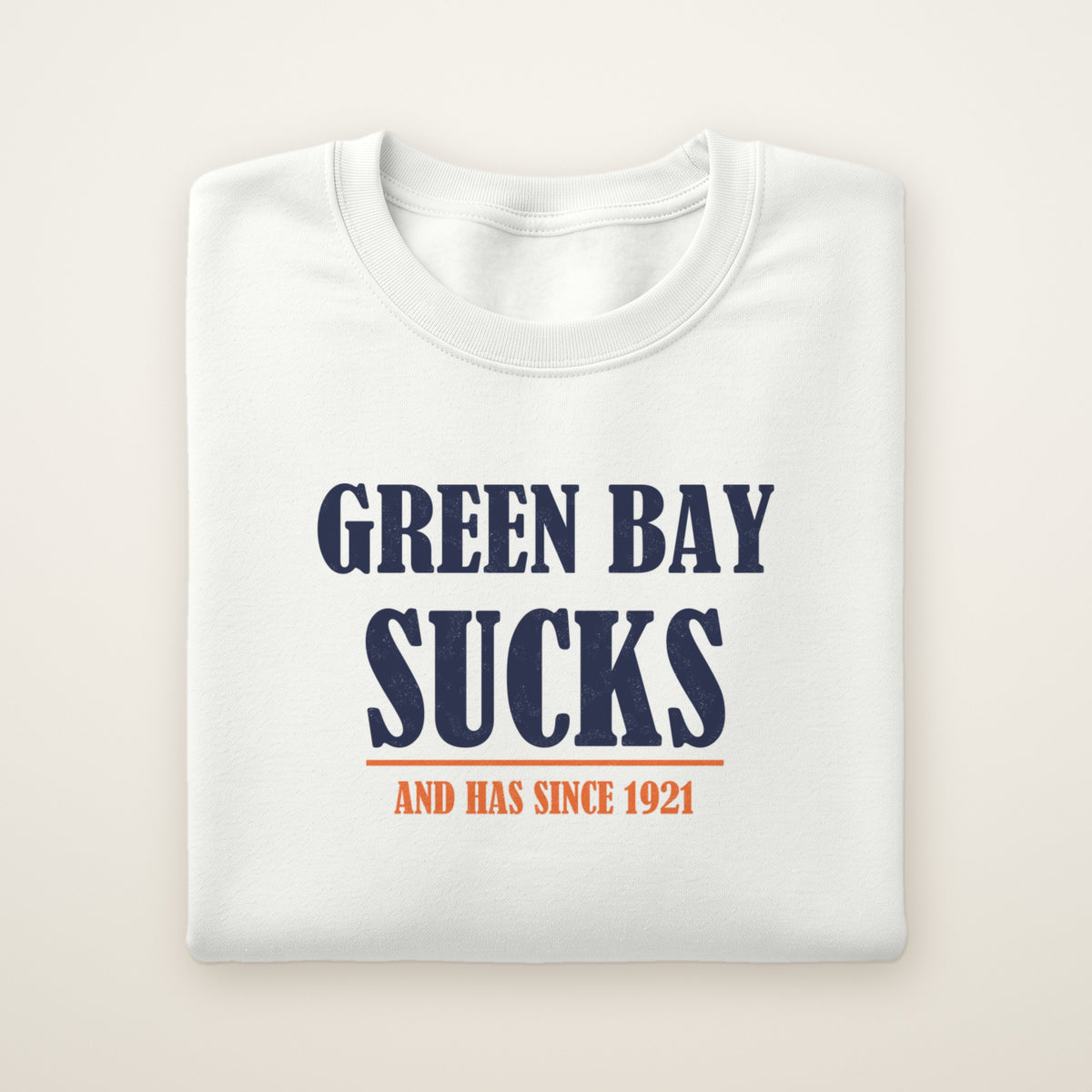 Green Bay Sucks And Has Since 1921 crewneck in White, flat lay with navy block type