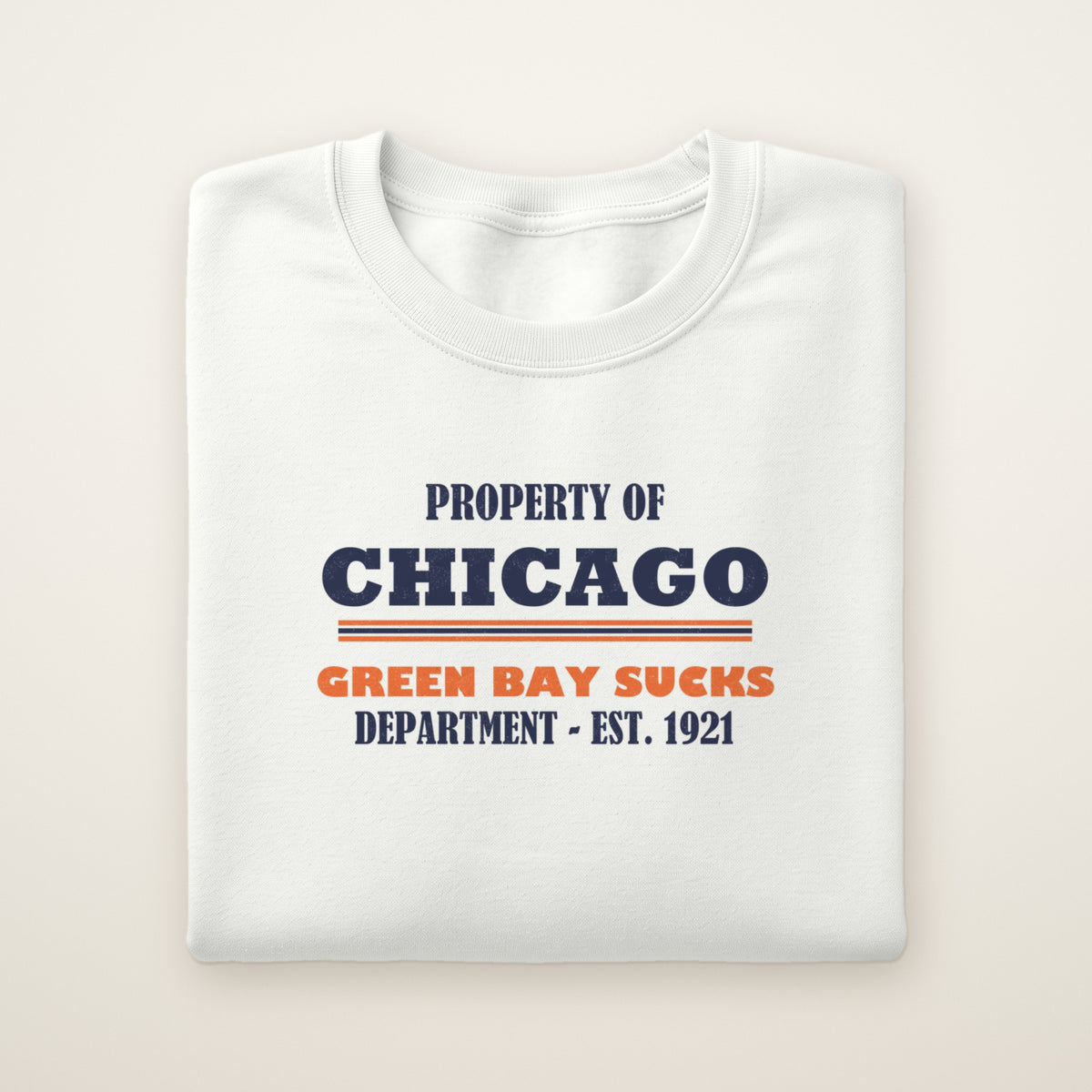 Property of Chicago Green Bay Sucks Dept. crewneck in White, flat lay with navy and orange print