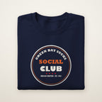 Green Bay Sucks Social Club crewneck in Navy, flat lay with circular Chicago Chapter badge