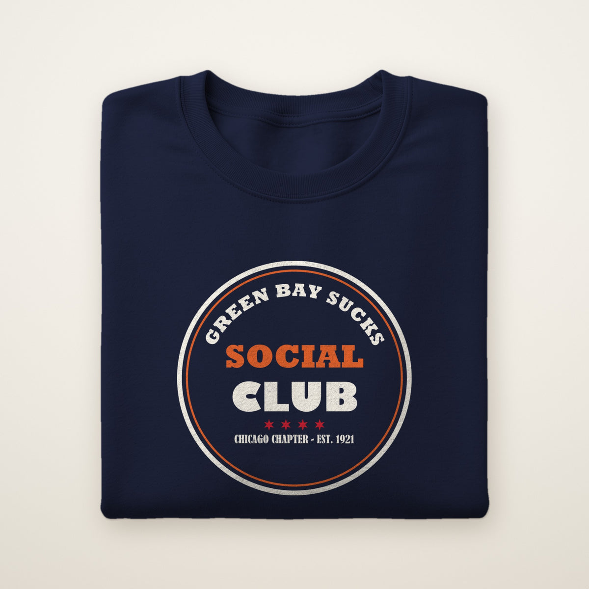 Green Bay Sucks Social Club crewneck in Navy, flat lay with circular Chicago Chapter badge