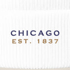Close-up of navy CHICAGO EST. 1837 embroidery on a white beanie cuff
