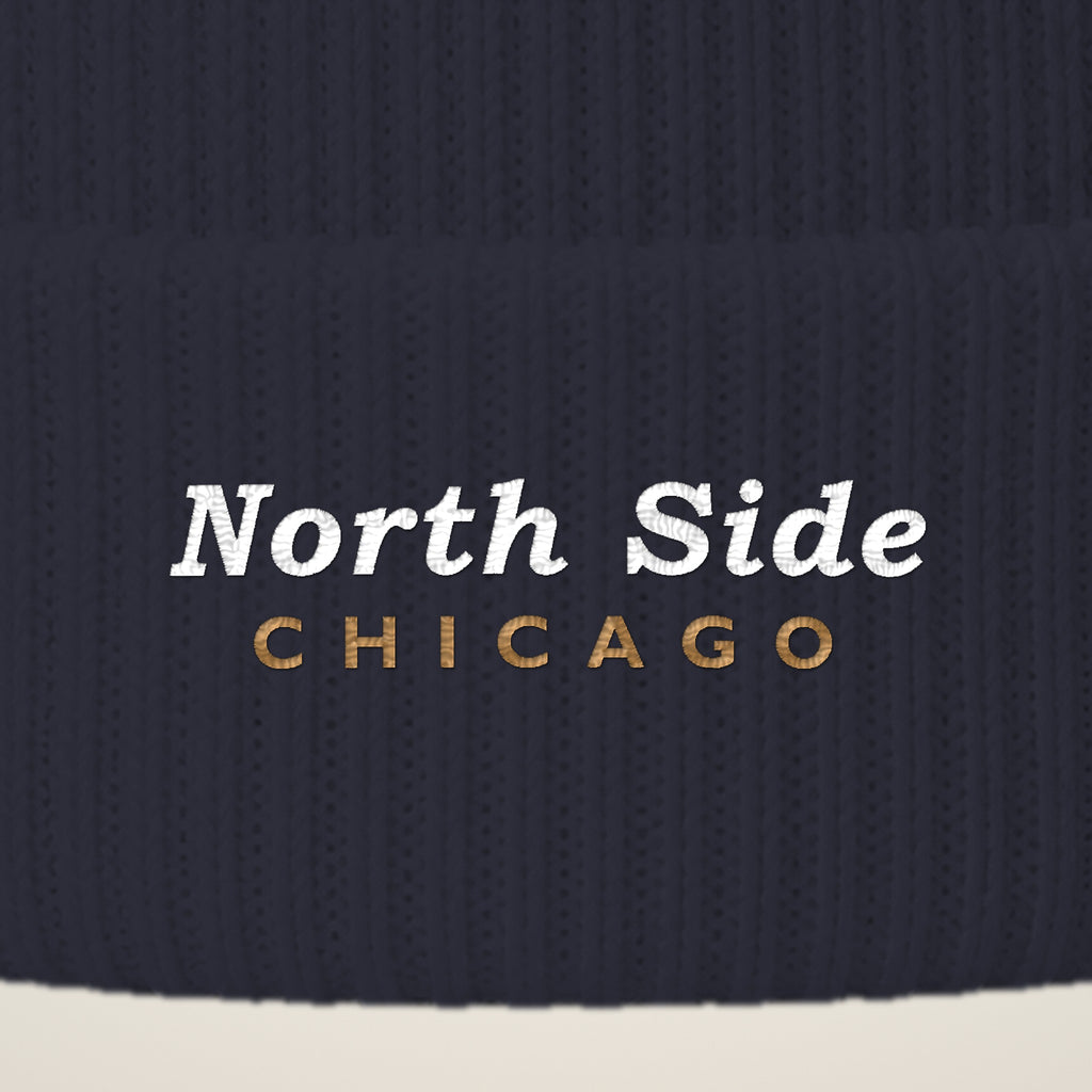 Close-up of North Side Chicago embroidery on the pom-pom beanie cuff