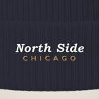 Close-up of North Side Chicago embroidery on the pom-pom beanie cuff
