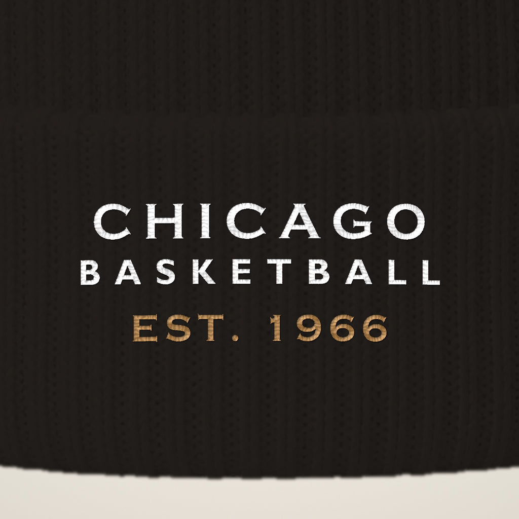 Close-up of CHICAGO BASKETBALL EST. 1966 embroidery on the pom-pom beanie cuff