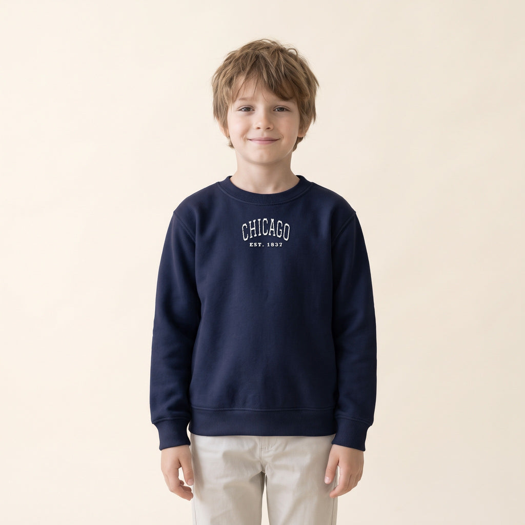 Child wearing the Chicago embroidered youth crewneck in Navy, white thread