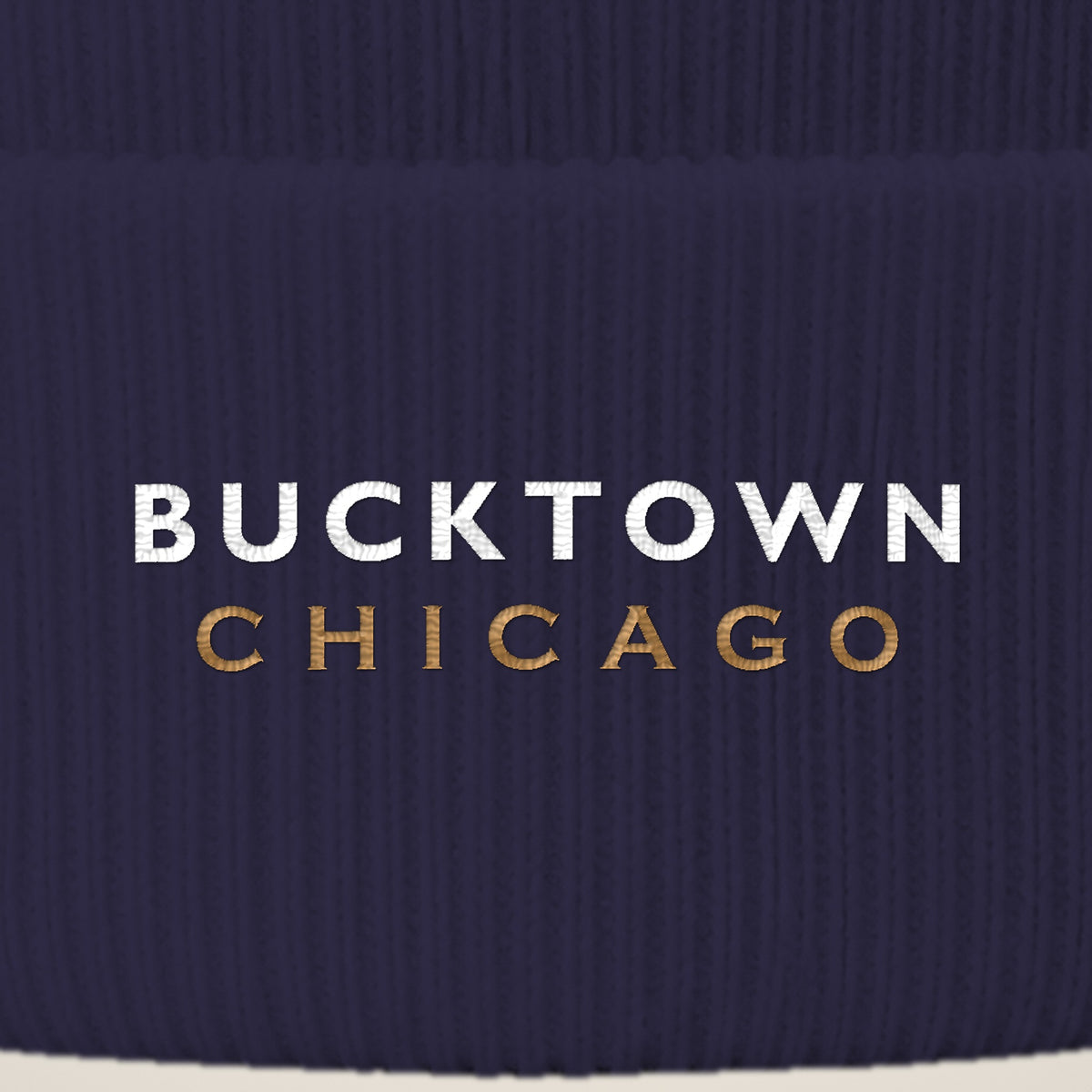 Bucktown Chicago embroidery close-up in white and old gold thread