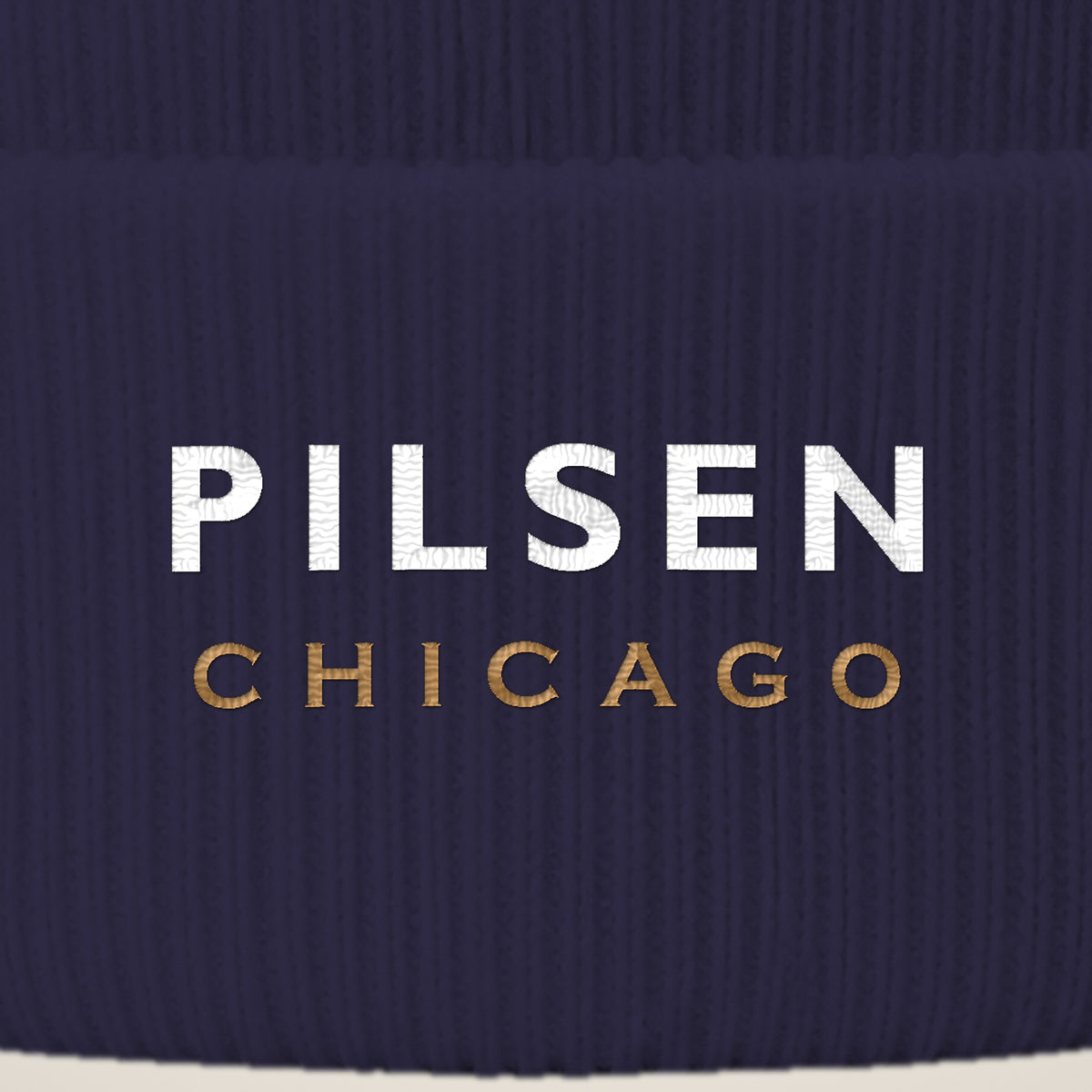 Pilsen Chicago embroidery close-up in white and old gold thread