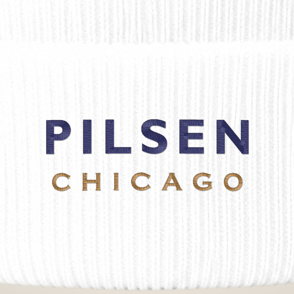 Pilsen Chicago embroidery close-up in navy and old gold thread