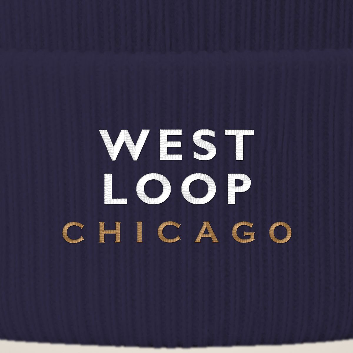 West Loop Chicago embroidery close-up in white and old gold thread