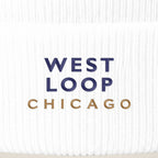 West Loop Chicago embroidery close-up in navy and old gold thread
