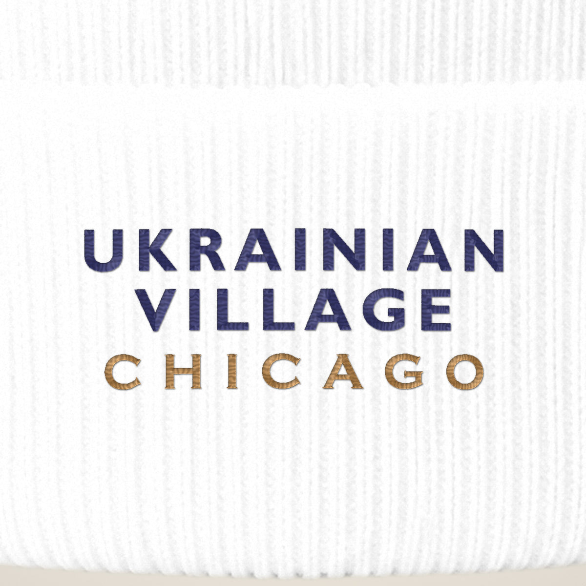 Ukrainian Village Chicago embroidery close-up in navy and old gold thread