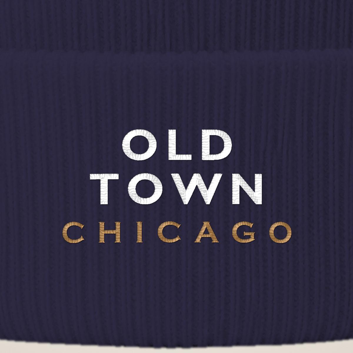 Old Town Chicago embroidery close-up in white and old gold thread