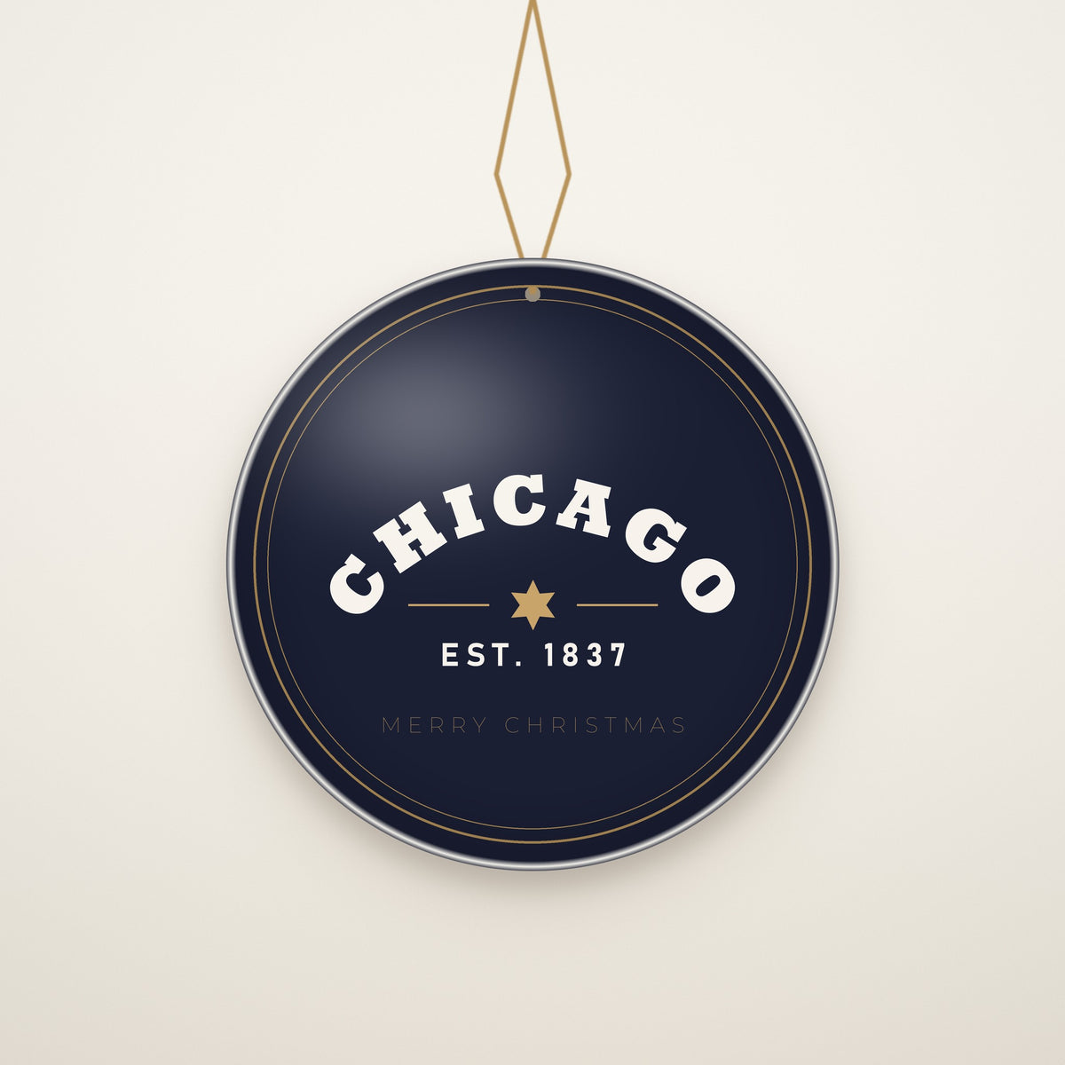 Chicago Est. 1837 Ceramic Christmas Ornament hanging on a gold cord, ivory backdrop
