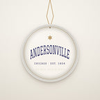 Andersonville Chicago Christmas Ornament, Est. 1854 hanging on a gold cord, ivory backdrop