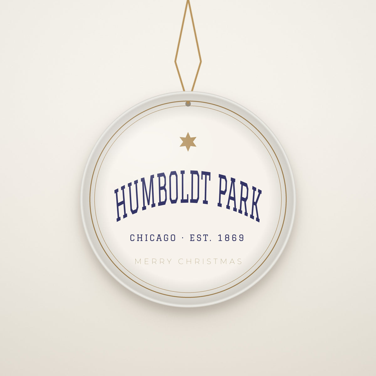 Humboldt Park Chicago Christmas Ornament, Est. 1869 hanging on a gold cord, ivory backdrop