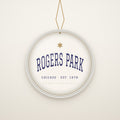 Rogers Park Chicago Christmas Ornament, Est. 1878 hanging on a gold cord, ivory backdrop