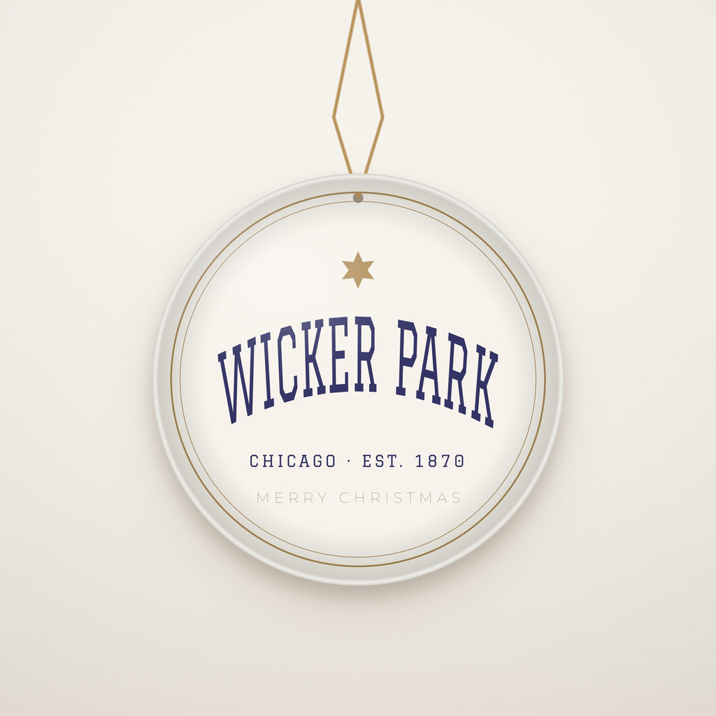 Wicker Park Chicago Christmas Ornament, Est. 1870 hanging on a gold cord, ivory backdrop