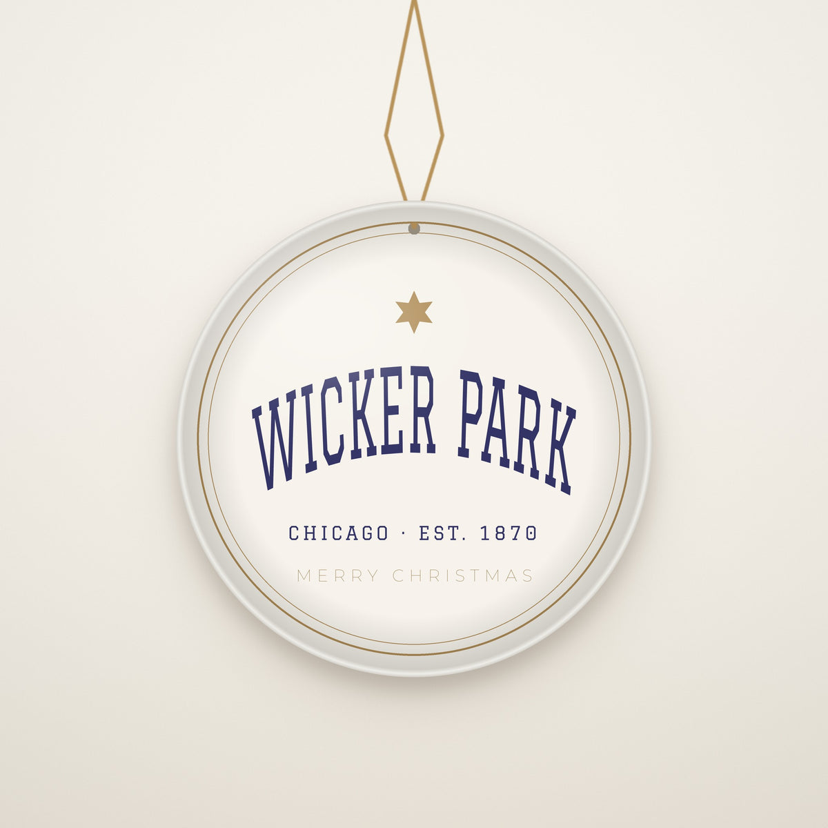 Wicker Park Chicago Christmas Ornament, Est. 1870 hanging on a gold cord, ivory backdrop