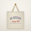 No Ketchup Canvas Tote Bag hanging from a brass peg on an ivory wall