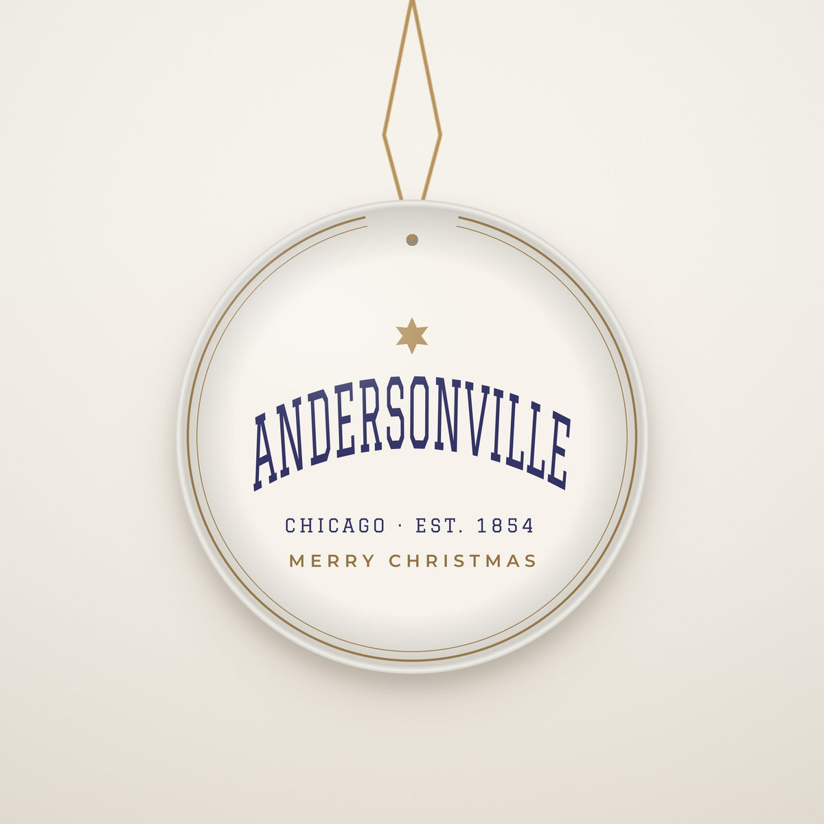 Andersonville Chicago Christmas Ornament, Est. 1854 hanging on a gold cord, ivory backdrop