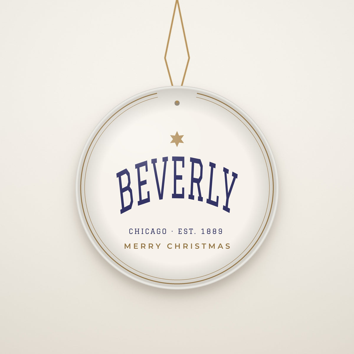 Beverly Chicago Christmas Ornament, Est. 1889 hanging on a gold cord, ivory backdrop