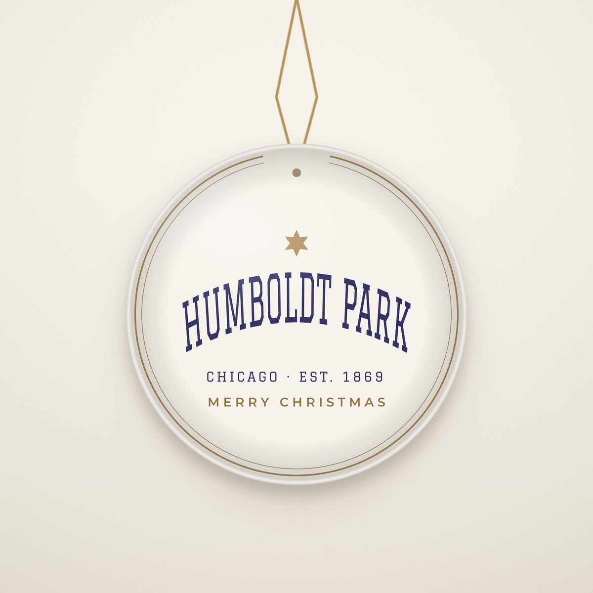 Humboldt Park Chicago Christmas Ornament, Est. 1869 hanging on a gold cord, ivory backdrop