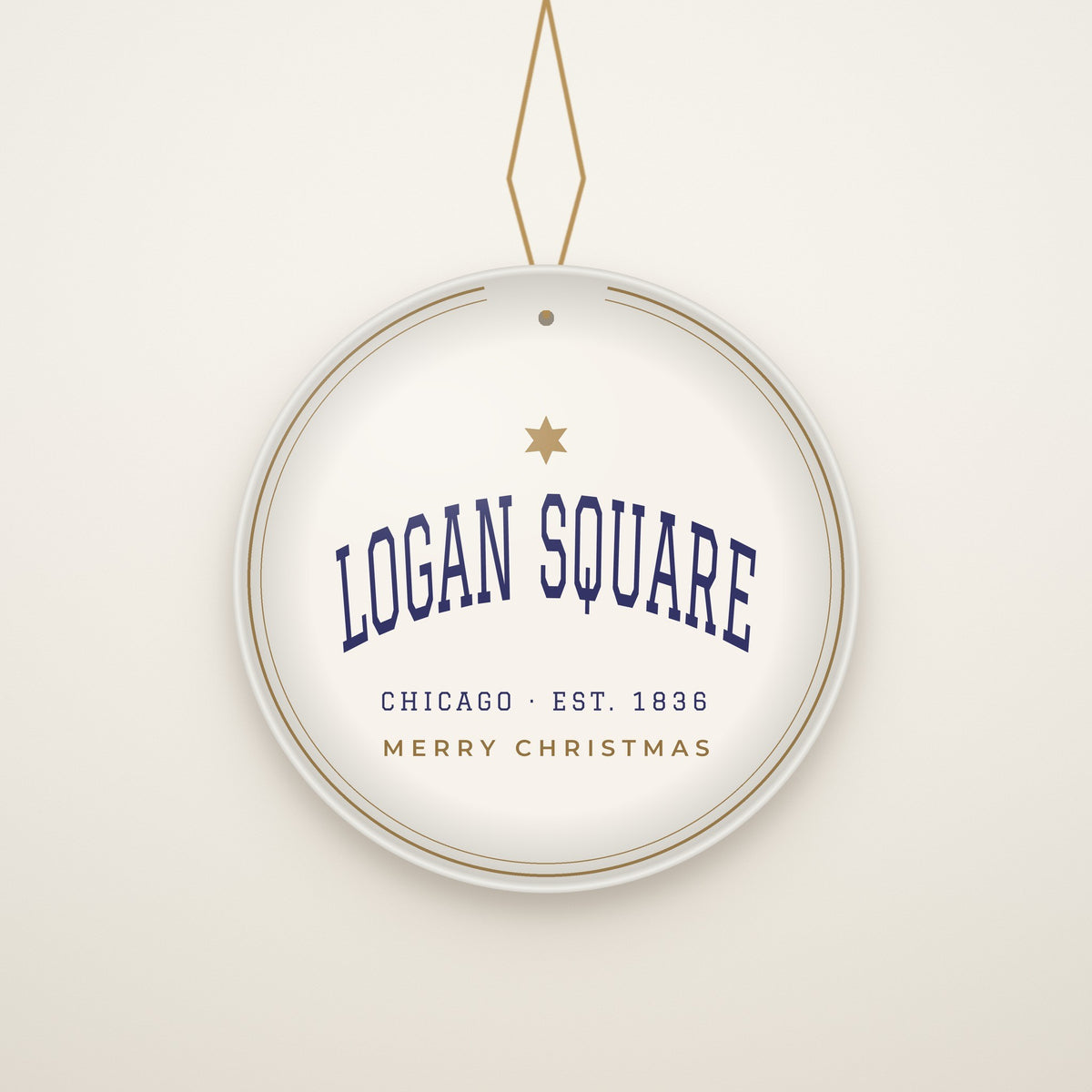 Logan Square Chicago Christmas Ornament, Est. 1836 hanging on a gold cord, ivory backdrop