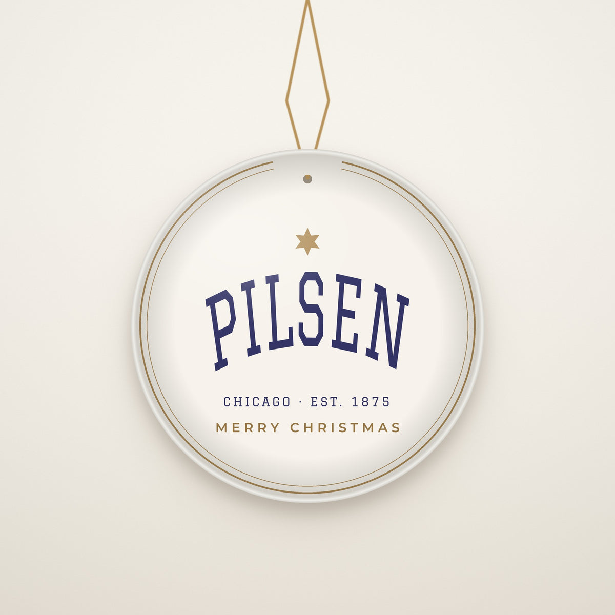 Pilsen Chicago Christmas Ornament, Est. 1875 hanging on a gold cord, ivory backdrop