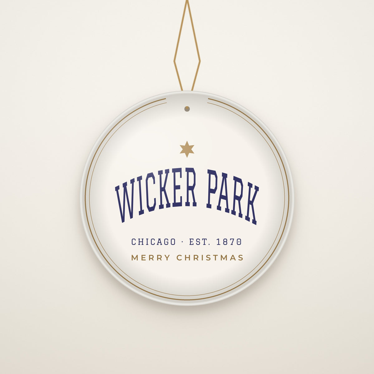 Wicker Park Chicago Christmas Ornament, Est. 1870 hanging on a gold cord, ivory backdrop