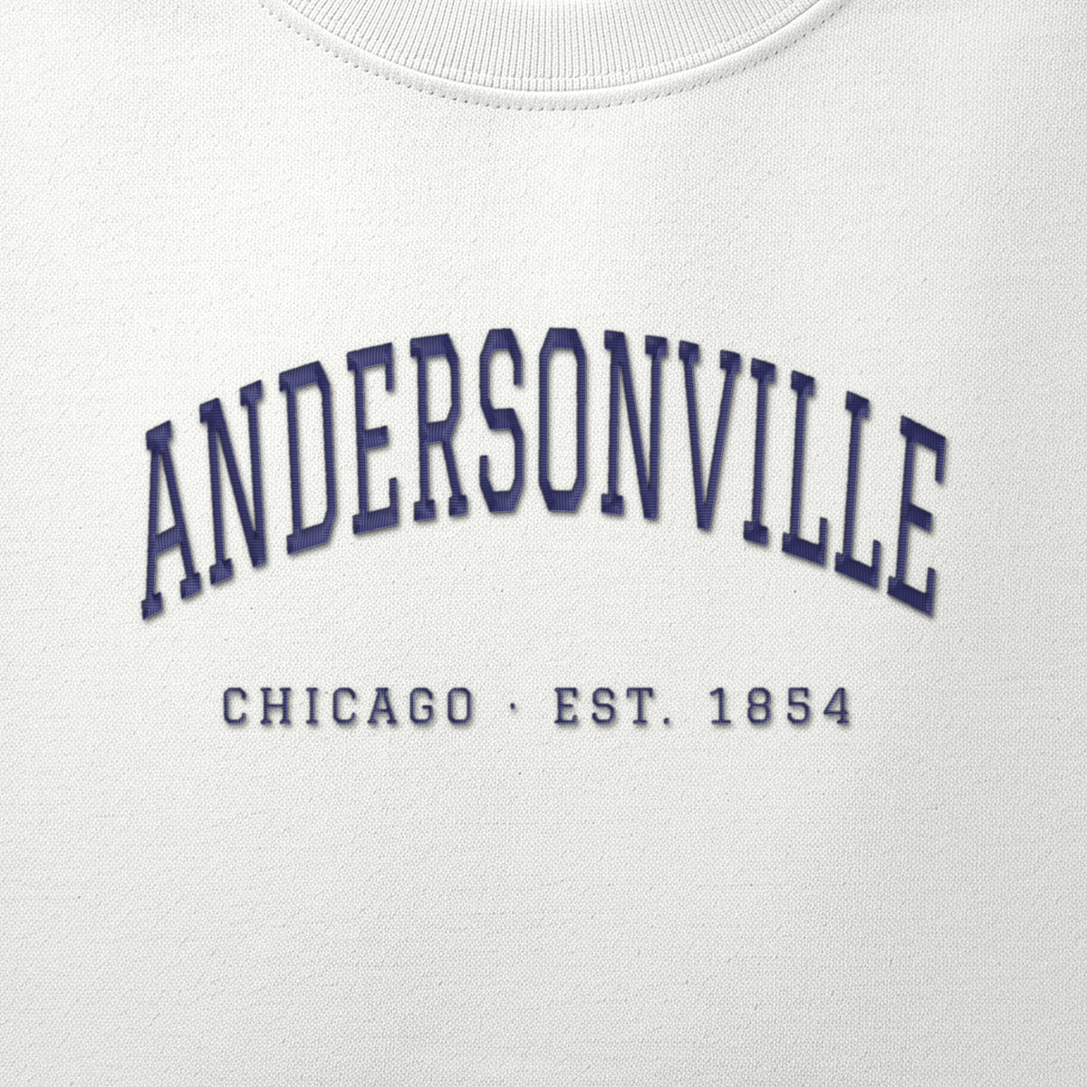 Close-up of navy satin-stitch Andersonville embroidery
