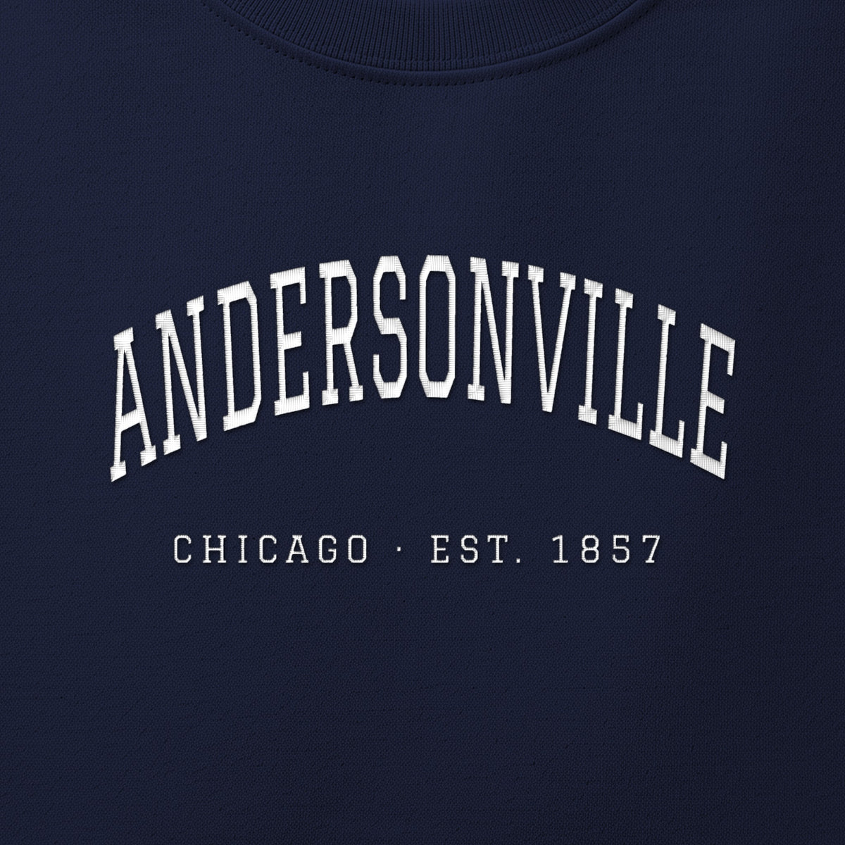 Close-up of white satin-stitch Andersonville embroidery