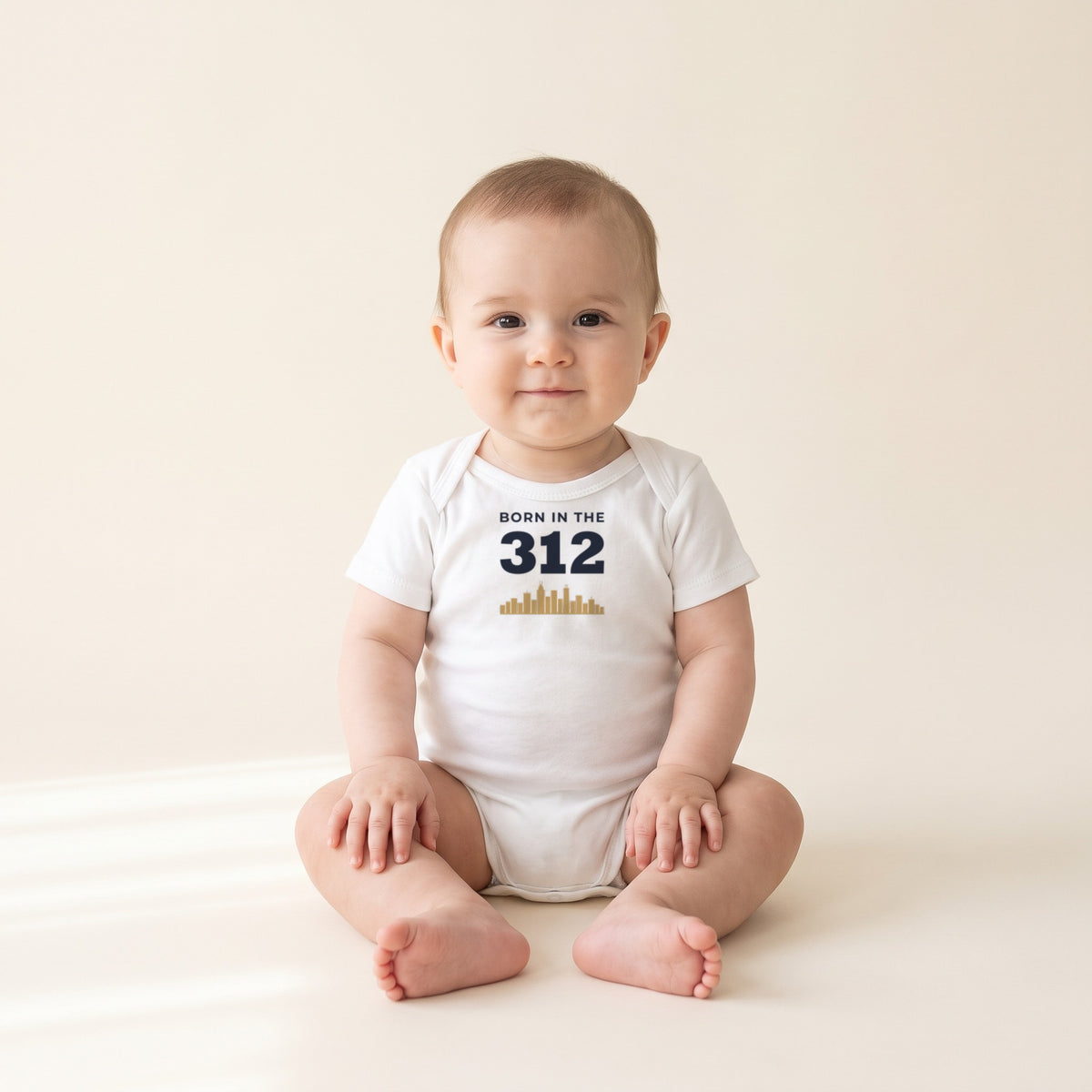 Baby wearing the Born in the 312 Baby Bodysuit in White