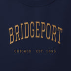 Close-up of gold satin-stitch Bridgeport embroidery