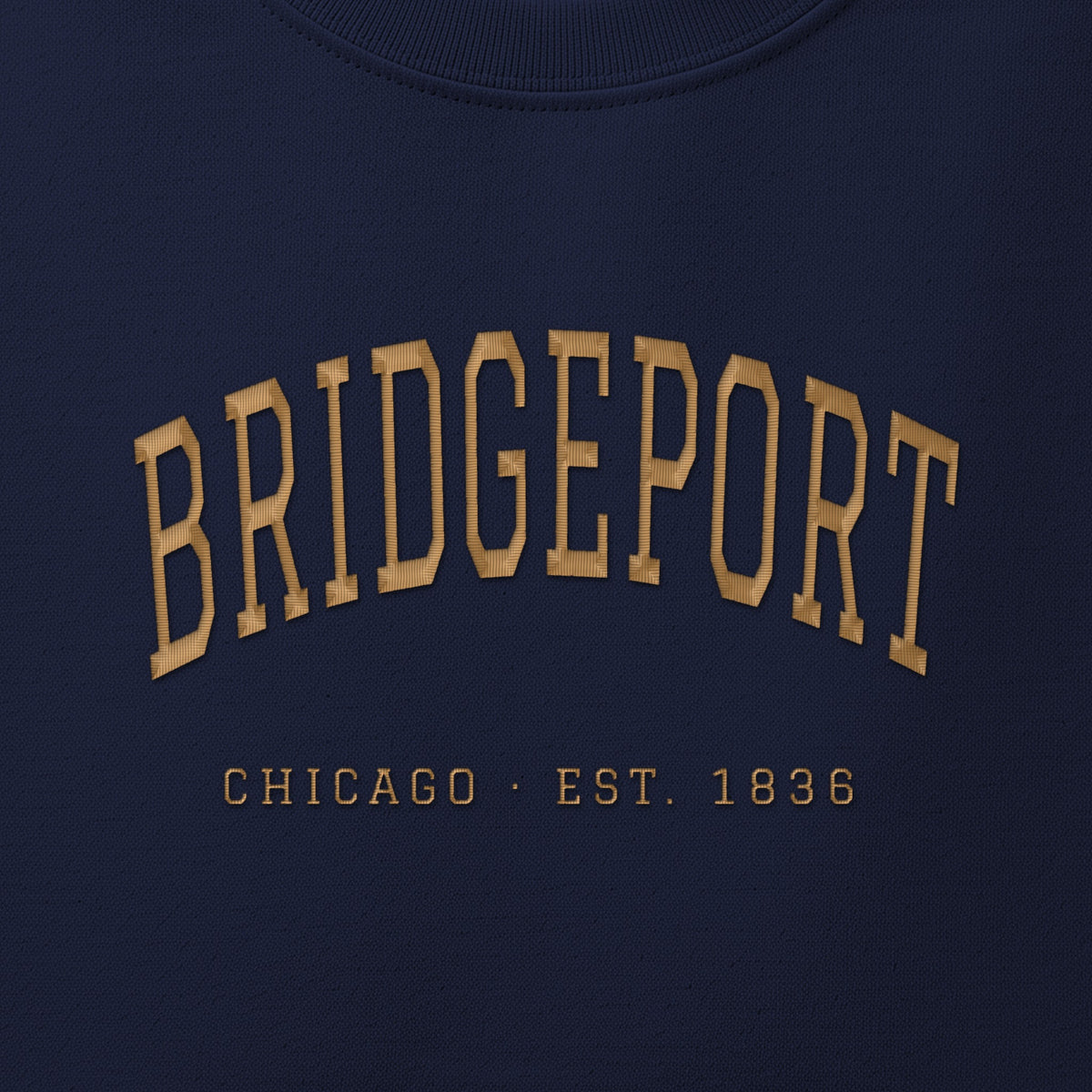 Close-up of gold satin-stitch Bridgeport embroidery