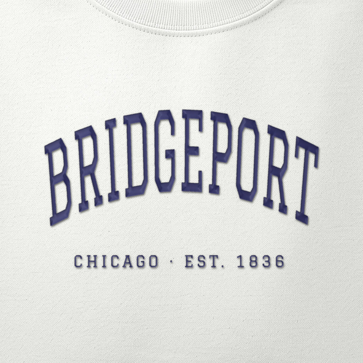 Close-up of navy satin-stitch Bridgeport embroidery