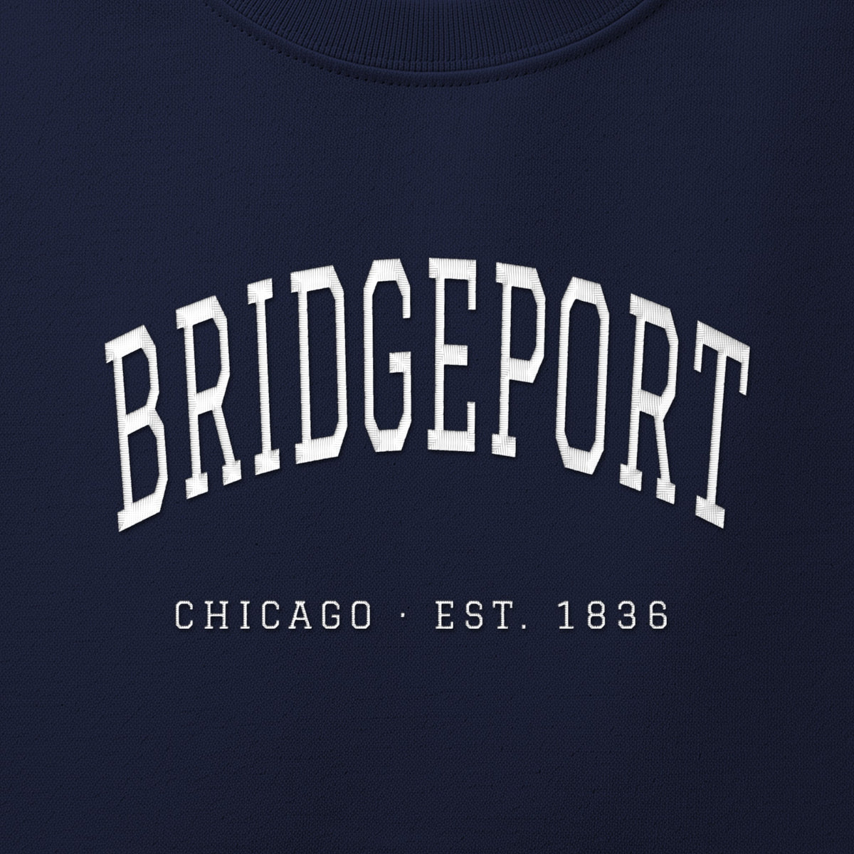 Close-up of white satin-stitch Bridgeport embroidery
